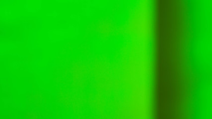 green blurred background with a black stripe on the right side