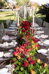 A beautifully decorated food and drinks table with candles