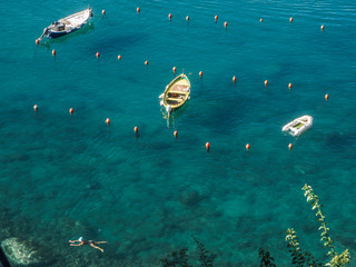 boats in a crystal clear ocean