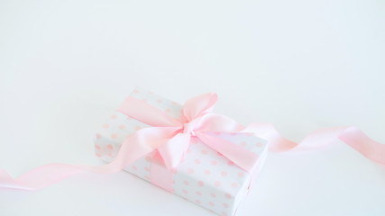 gift with pink ribbon for girl or woman