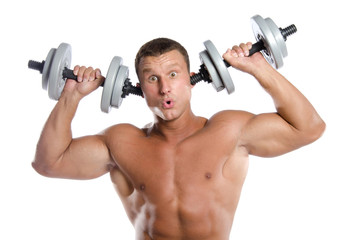 Fototapeta na wymiar Young funny bodybuilder and dumbbells.