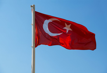 Turkish flag waving in blue sky