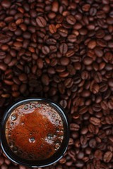Delicious fresh coffee in a black mug