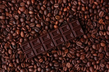 Delicious brown chocolate and coffee beans close up