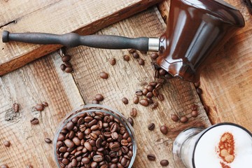 Roasted coffee beans and a cinnamon Dolce latte