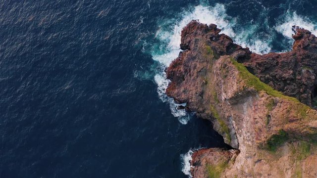 Aerial drone video flying over Faroe islands coastline, glowing by sunset light. Kalsoy island, Faroe islands, Denmark. UHD 4k video