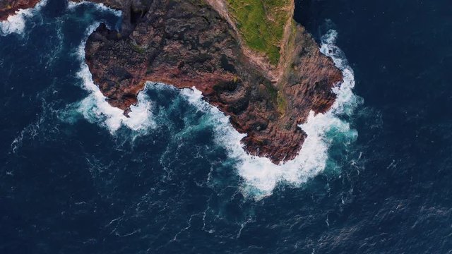 Aerial drone video flying over Faroe islands coastline, glowing by sunset light. Kalsoy island, Faroe islands, Denmark. UHD 4k video