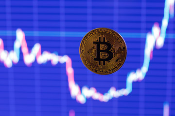 bitcoin shiner flying over blurry dark blue exchange graphic chart