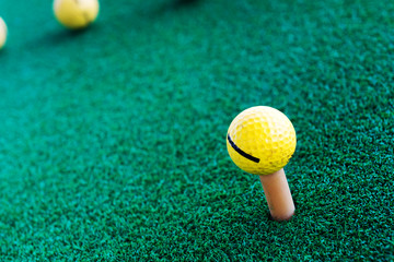 Golf training balls on green grass.