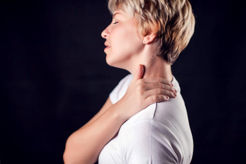 Woman feels neck pain. People, healthcare and medicine concept
