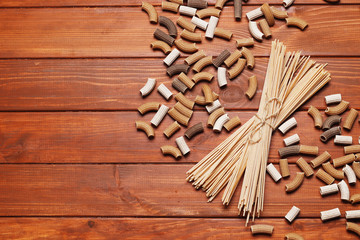 composition of buckwheat pasta on a wooden background. top view. Place for text.