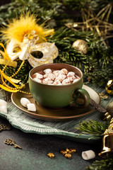Christmas greeting card with hot chocolate milk drink with marshmallows and festive decoration. Holiday concept with copy space.