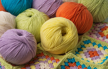 Fototapeta na wymiar Balls of colored yarn background
