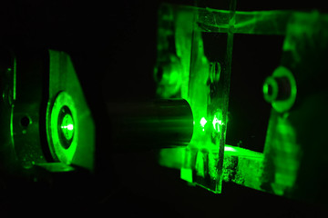 Green light in the laboratory. Green laser in dark.