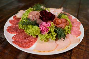 Assorted meat on a large wooden table
