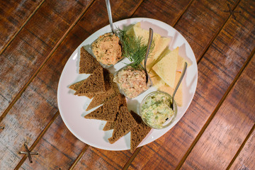 Tasty croutons with formak, liver pate and lard with garlic. Russian appetizer