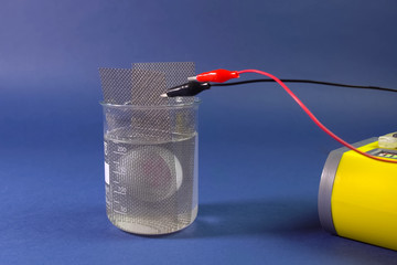 Checking the conductivity of the substance. Anode and cathode in