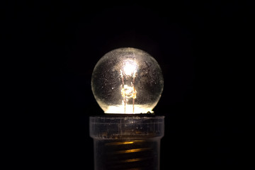 small three volt incandescent light bulb Burning lamp.