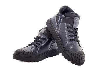 Man's leather black boots isolated on a white background