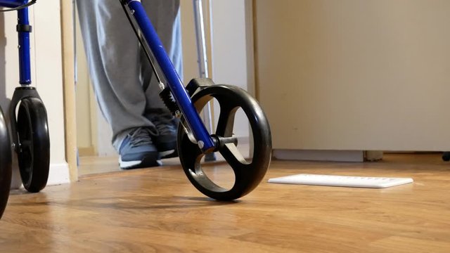 Person Uses Crutches Walking Toward Camera