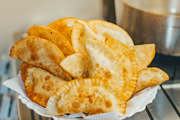 frying homemade pastries at home, brazilian cultural salty food