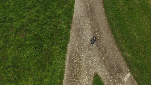 Woman at the crossroads. Symbol of choice.  Aerial shot from the drone.4K