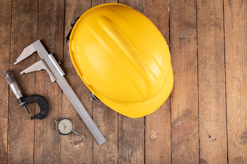 Protective helmet and measuring tools. Work accessories for production workers and engineers.