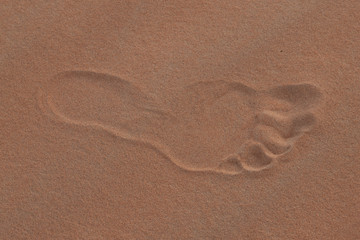 Fototapeta na wymiar Human foot print at desert sand in the United Arab Emirates