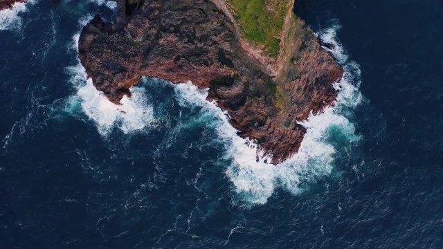 Aerial drone video flying over Faroe islands coastline, glowing by sunset light. Kalsoy island, Faroe islands, Denmark. UHD 4k video
