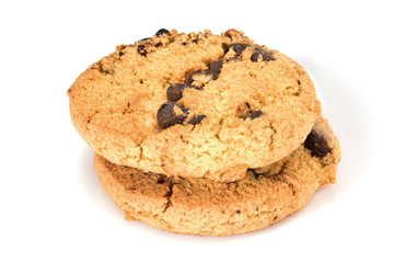 Homemade cookies. Two sweet cookies with chocolate chips. Tasty biscuit in high resolution close-up, isolated on white background with small shadows. Homemade bakery.