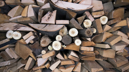  Wooden log wooden background. Detail of logs stacked for firewood. Preparation of firewood for the winter. Pile of firewood. 