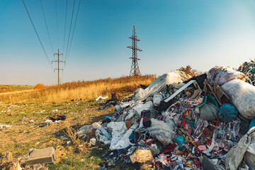 garbage dump hill polluted field environmental country side space with electricity high voltage wires tower urban landscaping object, Earth global disaster concept 