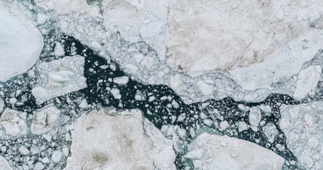 Icebergs drone aerial photo top view - Climate Change and Global Warming - Icebergs from melting glacier in icefjord in Ilulissat, Greenland. Arctic nature ice landscape in Unesco World Heritage Site. © Maridav