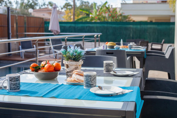 set table with oranges and croissants