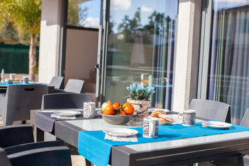 set table with oranges and croissants