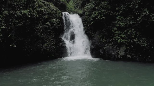 Waterfall in Bali Island tropical mountains 4K Drone flight