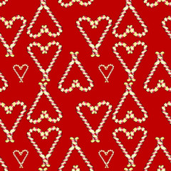 Sweet caramel hearts pattern. Hand drawn illustration. Cute festive pattern for Christmas and all lovers. Cozy design for fabric, gift wrap, card decoration, digital paper. Red background