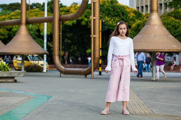 Beautiful young girl at the Jairo Varela Square in the city of Cali in Colombia
