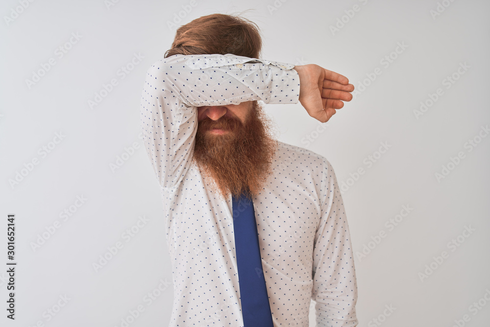 Sticker young redhead irish businessman standing over isolated white background covering eyes with arm smili