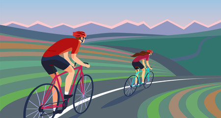 Pair of cyclists on the road near the hills banner.