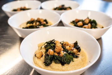 Bowls with chickpea hummus and kale