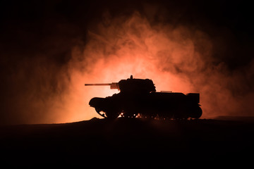 War Concept. Military silhouettes fighting scene on war fog sky background, Silhouette of armored...