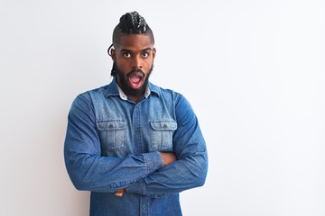 African american man with braids wearing denim shirt over isolated white background afraid and shocked with surprise expression, fear and excited face.