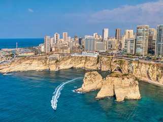 Rouche rocks in Beirut, Lebanon in the sea during daytime. Pigeon Rocks in Mediterranean sea.