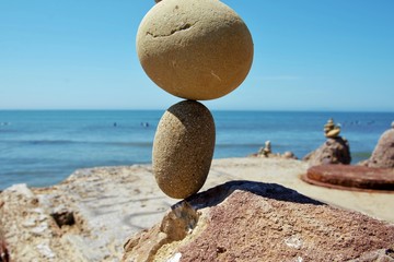 rock balancing on beach