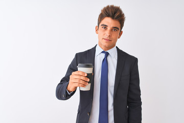 Young handsome businessman wearing suit holding coffee over isolated white background with a confident expression on smart face thinking serious