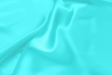 Obraz premium Cyan-Teal satin fabric texture soft blur background