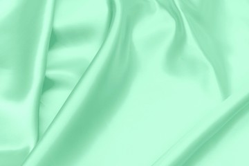 green satin fabric texture soft blur background