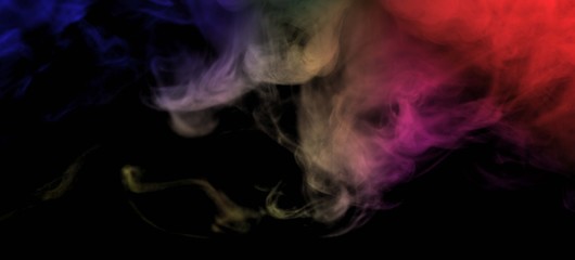 Obraz premium Abstract colorful smoke isolated on black background,Rainbow powder