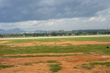Fototapeta na wymiar Bangalore to Pune, , a close up of a dry grass field